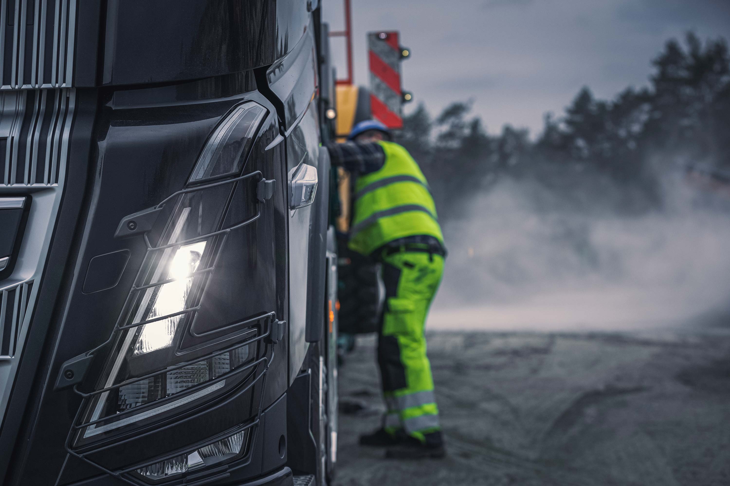 The characteristic Volvo FH16 headlamps.